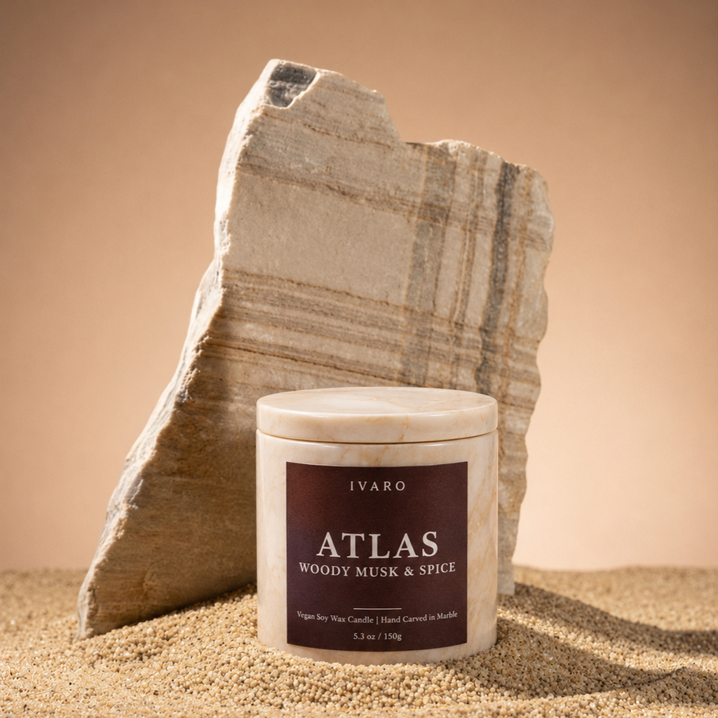 IVARO ATLAS luxury marble candle styled in a premium interior creating a warm elegant atmosphere